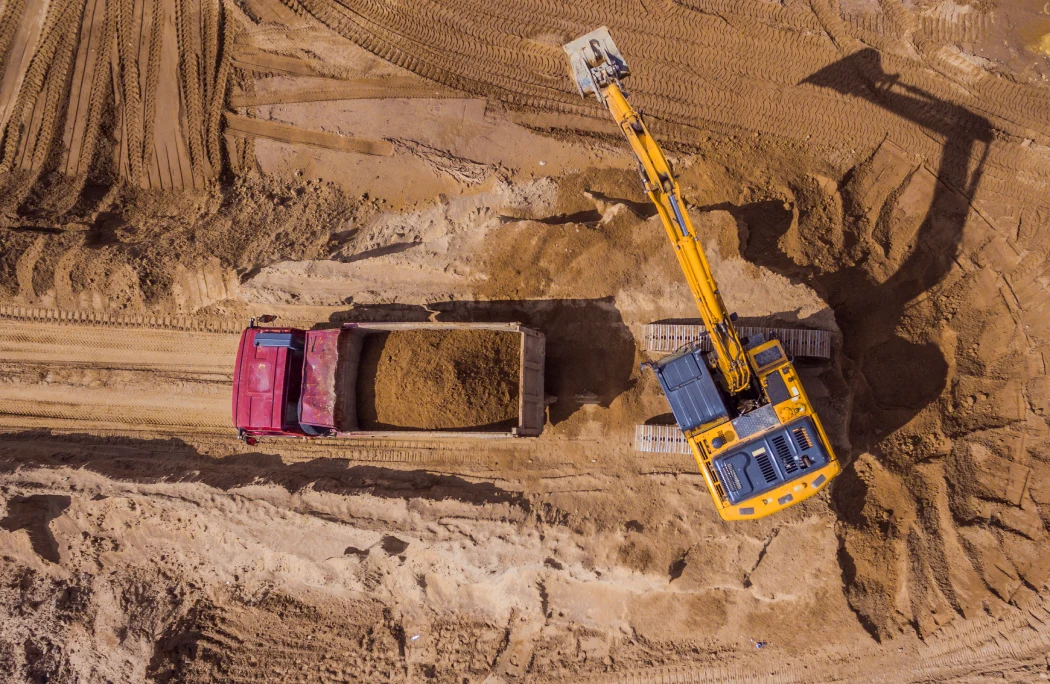 top-view-of-excavator-working-on-construction-site